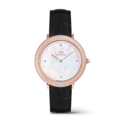 Rose gold ladies watch with a black croc-embossed leather strap, a shimmering crystal-set bezel, and a white mother of pearl dial with four crystal markers.