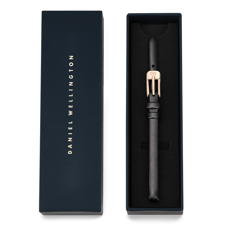 Pressed Sheffield Strap Rose Gold presented in a navy Daniel Wellington gift box, featuring a slim black leather strap with a rose gold buckle, ideal for gifting or upgrading your watch.