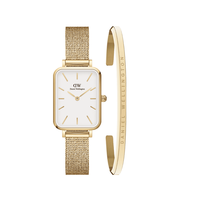 Rectangular gold mesh strap watch with a white face and gold accents, paired with a slim gold cuff bracelet engraved with the Daniel Wellington logo, shown as a stylish women’s jewellery set.
