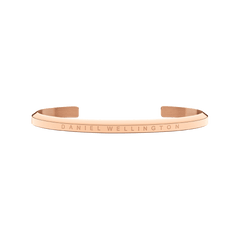 Classic Bracelet Rose Gold by Daniel Wellington in a minimalist open cuff style, featuring a slim stainless steel band with PVD plated rose gold and engraved branding.