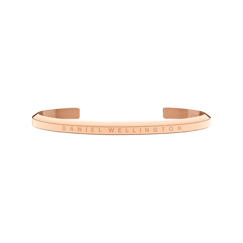 Classic Bracelet Rose Gold by Daniel Wellington in a minimalist open cuff style, featuring a slim stainless steel band with PVD plated rose gold and engraved branding.