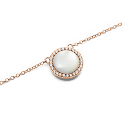 Close-up of the Audrey Necklace Mother of Pearl Rose Gold pendant, showcasing a domed mother of pearl centre surrounded by a halo of sparkling white cubic zirconia crystals on a rose gold chain.