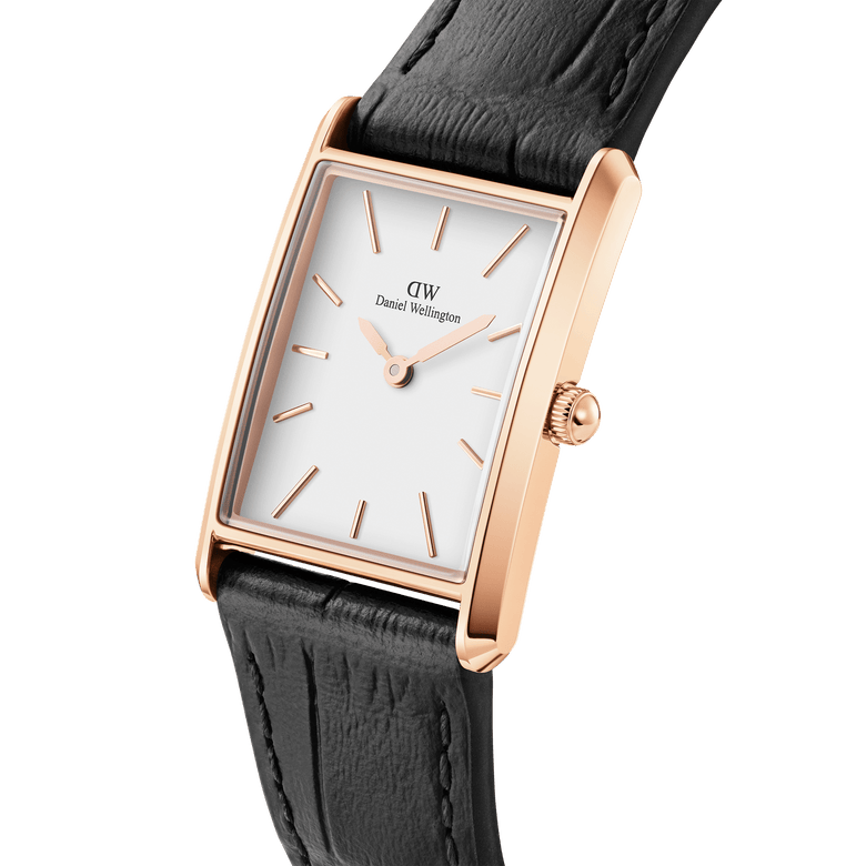 Bound Black Crocodile Rose Gold watch with a rectangular rose gold case, minimalist white dial, and a crocodile-embossed black leather strap, shown in a close-up angle highlighting its elegant design and refined finish.