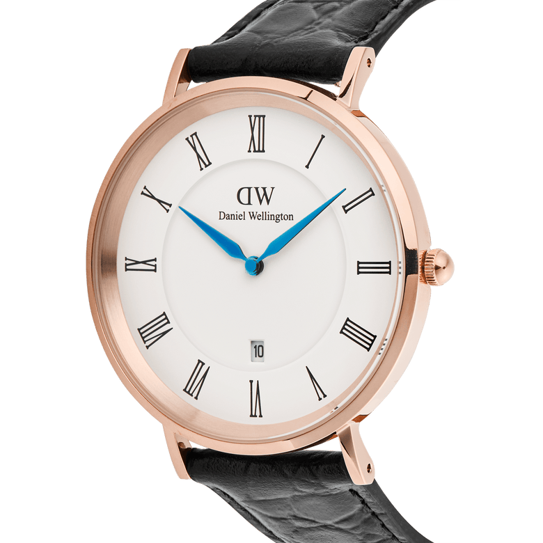 Classic Roman Numerals Date Black Croc Belly Rose Gold watch with a rose gold case, white dial featuring black Roman numerals, blue hands, a date window at six o’clock, and a black croc-embossed leather strap.