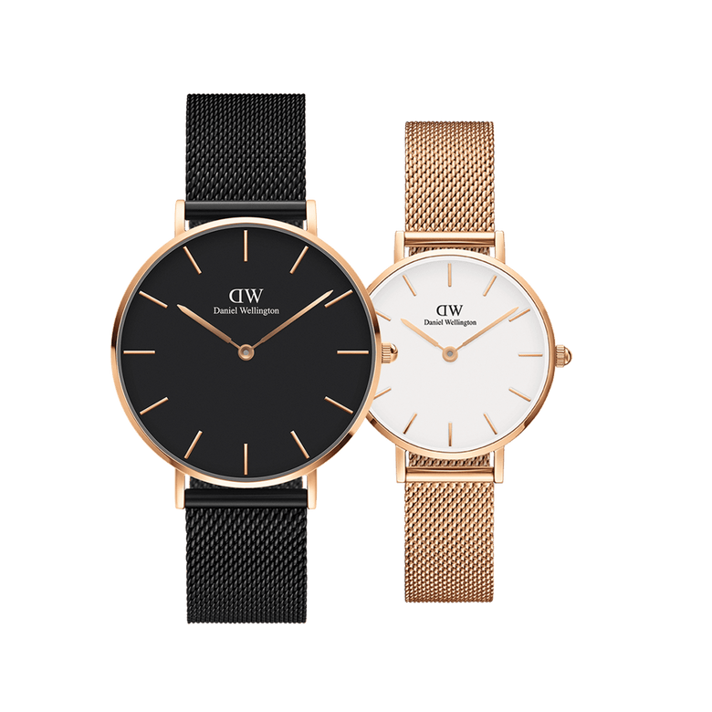 Daniel Wellington Petite Melrose + Petite Ashfield bundle featuring two mesh strap watches for women, one with a black dial and black mesh strap, and the other with a white dial and rose gold mesh strap, both with slim rose gold cases and minimalist design.