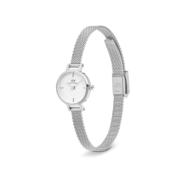 Petite Mini Sterling silver watch with a 19mm round dial, minimalist white face, and adjustable stainless steel mesh strap, shown from a side angle to highlight its slim profile and elegant clasp.