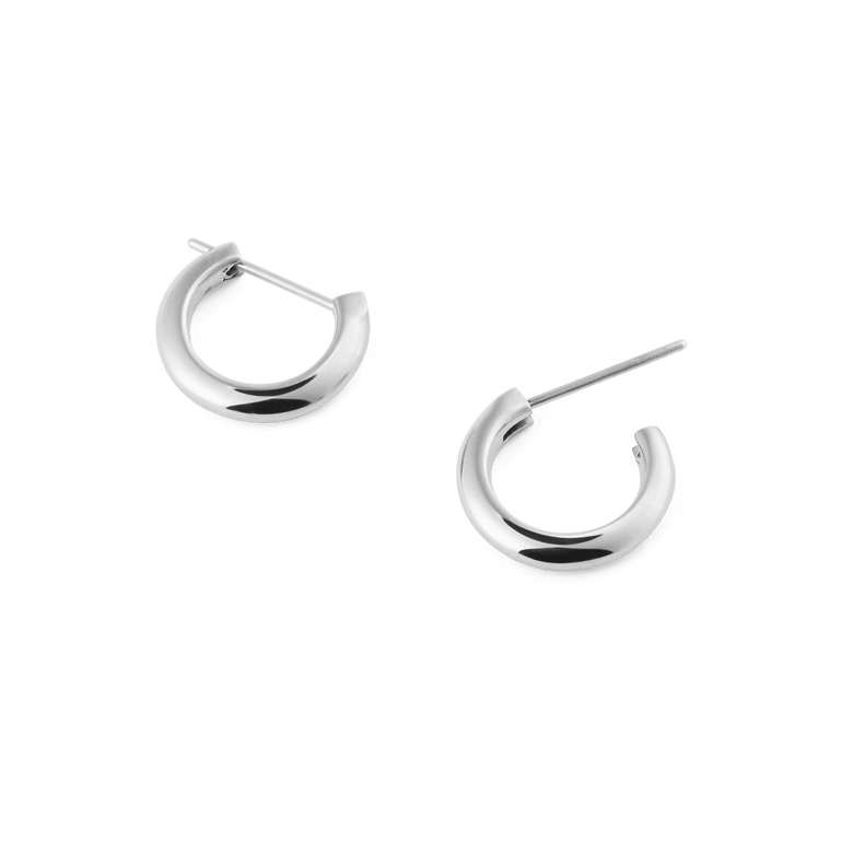 Arch Earring Silver 9mm features two small, polished stainless steel hoop earrings with a minimalist curved shape and classic pin closure, ideal for everyday wear.