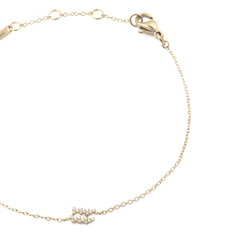 Crystal Zodiac Chain Bracelet Gold featuring a slim gold chain, adjustable sizing rings, and a sparkling crystal zodiac charm, finished with a lobster clasp for comfortable wear.