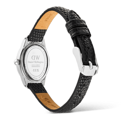 Rear view of the Daniel Wellington Ophelia Mini Black Lizard Ice Blue Guilloché Silver watch, showing the polished stainless steel case back, engraved branding, and textured black lizard-embossed leather strap with silver pin buckle.