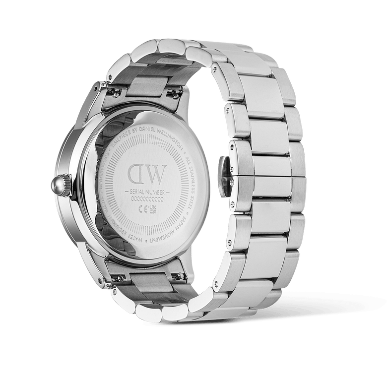Rear view of the Daniel Wellington Iconic Paradigma Link Black Bezel watch, showing the engraved stainless steel case back and robust three-link bracelet with a brushed finish.