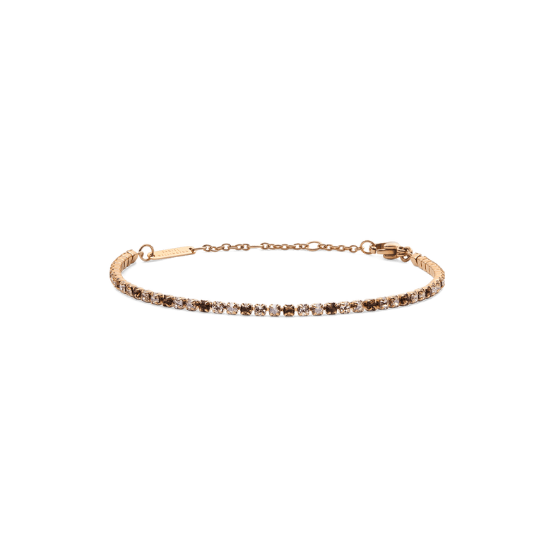 Slim rose gold tennis bracelet featuring alternating honey and clear crystals, with an adjustable chain and secure lobster clasp for a refined, elegant look.