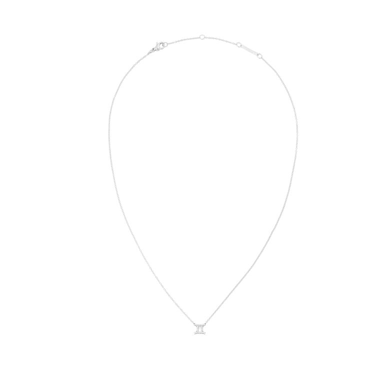 A delicate silver chain necklace featuring a Gemini zodiac pendant adorned with sparkling crystals, designed for a minimalist and elegant look.