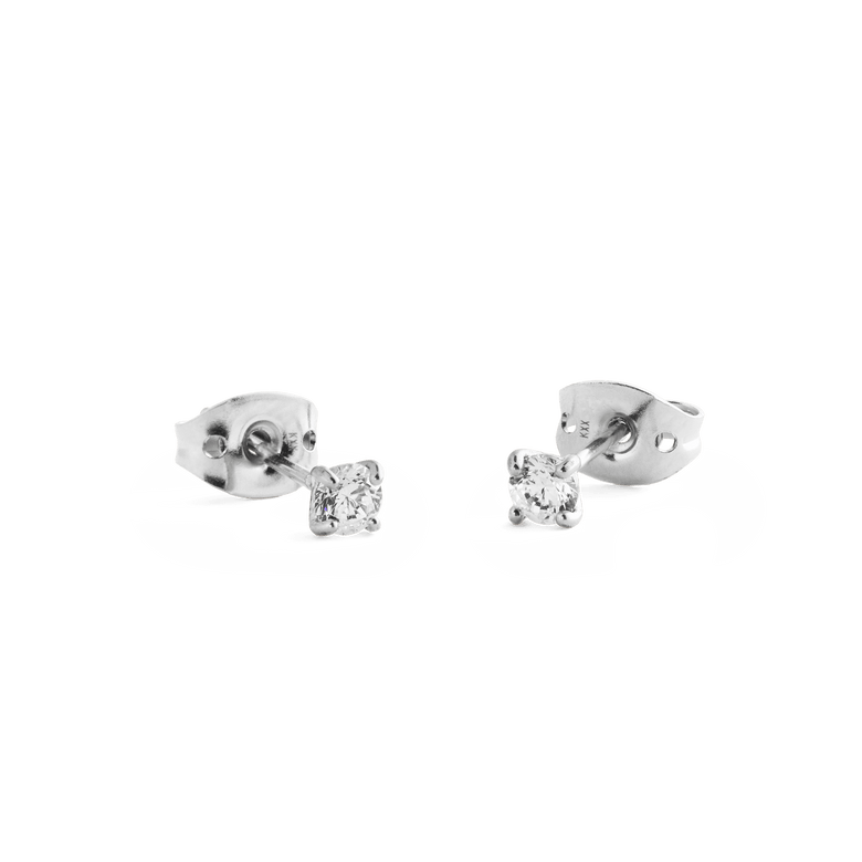 Mirelle Solitaire Stud Earring Silver shown with secure butterfly backs, featuring petite round white cubic zirconia crystals set in polished silver for a minimalist and comfortable everyday style.
