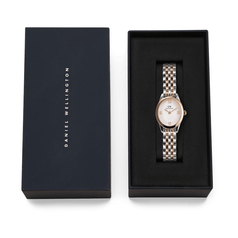 Daniel Wellington Ophelia Mini Two Tone Rose Gold watch presented in its original navy gift box, showcasing the elegant oval face and polished rose gold and silver bracelet.