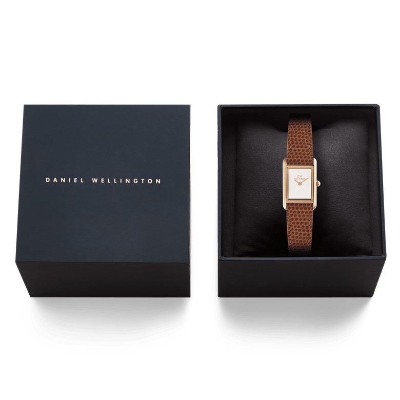 Daniel Wellington Bound Mini Light Brown Lizard Rose Gold watch presented in a black gift box, showing the slim rectangular case and brown lizard-textured leather strap alongside the branded box lid.