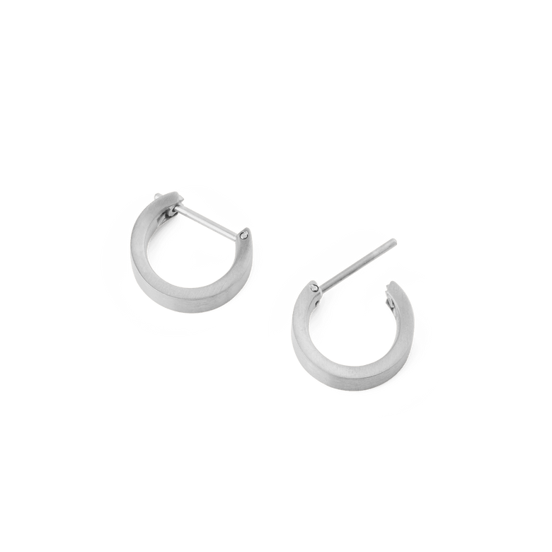 A pair of Line Earring Brushed Silver 3.5mm hoop earrings shown open, highlighting their softly brushed silver finish, minimalist design, and secure latch-back posts.