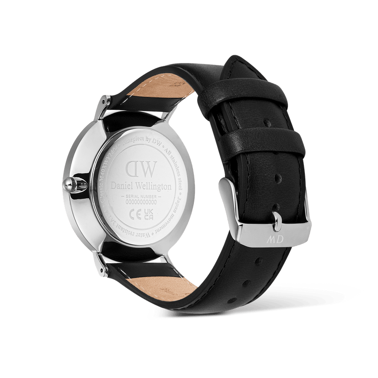 The back view of the Classic Day Display Sheffield Silver watch highlights the engraved stainless steel case, genuine black leather strap, and secure tongue buckle closure.