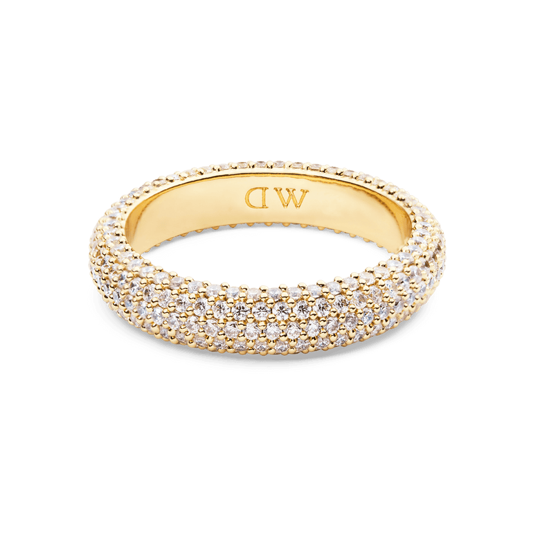 Pavé Ring Gold 5 mm featuring a classic gold-plated band with rows of white cubic zirconia crystals in a pavé setting, offering a bold and elegant look for women’s jewellery collections.