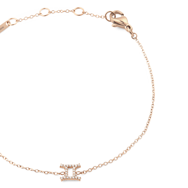 Close-up of the Crystal Zodiac Chain Bracelet Rose Gold, featuring a slim adjustable rose gold chain and a crystal-set Gemini zodiac pendant.
