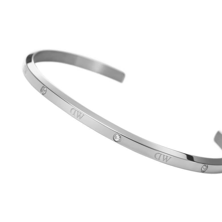 Classic Lumine Bracelet S featuring a slim, polished silver cuff with six sparkling crystals and an open design, crafted for comfortable everyday wear and easy stacking with other jewellery.