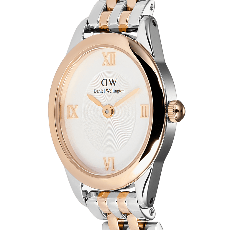 Close-up of the Daniel Wellington Ophelia Mini Two Tone Rose Gold watch, highlighting its slim oval case, white dial with rose gold Roman numerals, and polished two-tone rose gold and silver bracelet.
