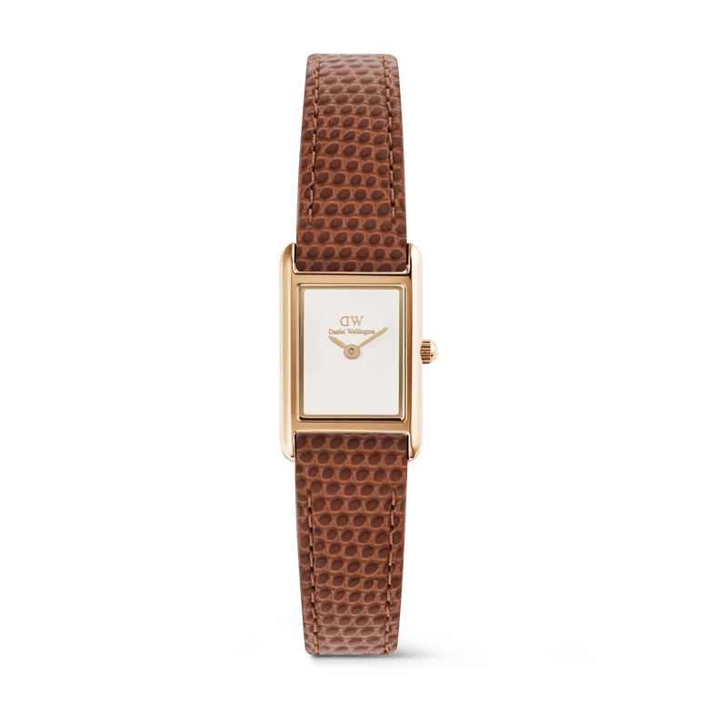 Petite ladies watch with a rectangular rose gold case, minimalist white dial, and light brown lizard-textured leather strap, designed for everyday elegance and versatility.