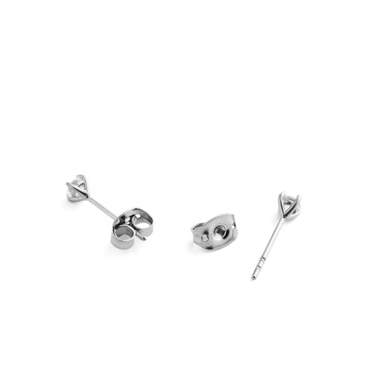 Close-up of Mirelle Solitaire Stud Earring Silver butterfly backs and posts, highlighting the polished stainless steel construction and secure fastening for comfortable daily wear.