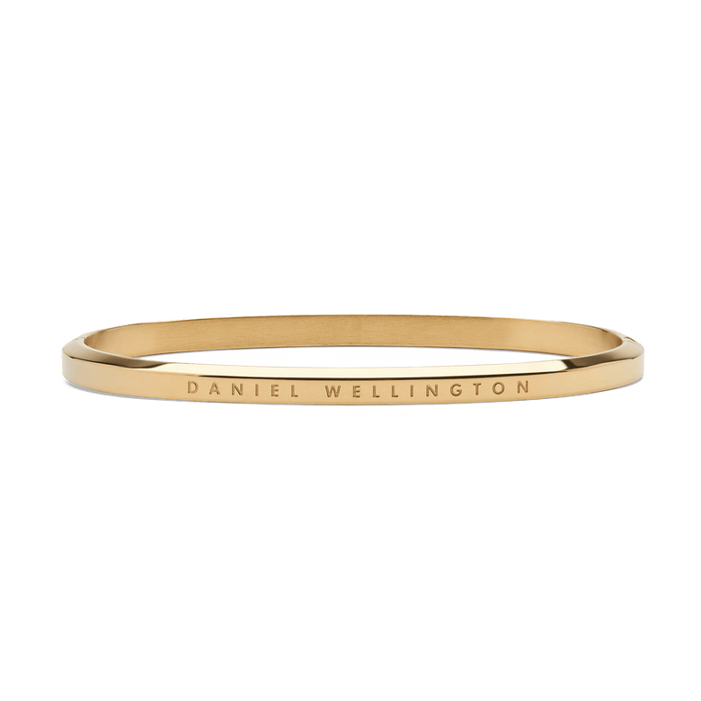 Classic Bangle Gold features a slim, polished gold finish with the Daniel Wellington logo engraved along the outer edge, showcasing its minimalist and timeless design.