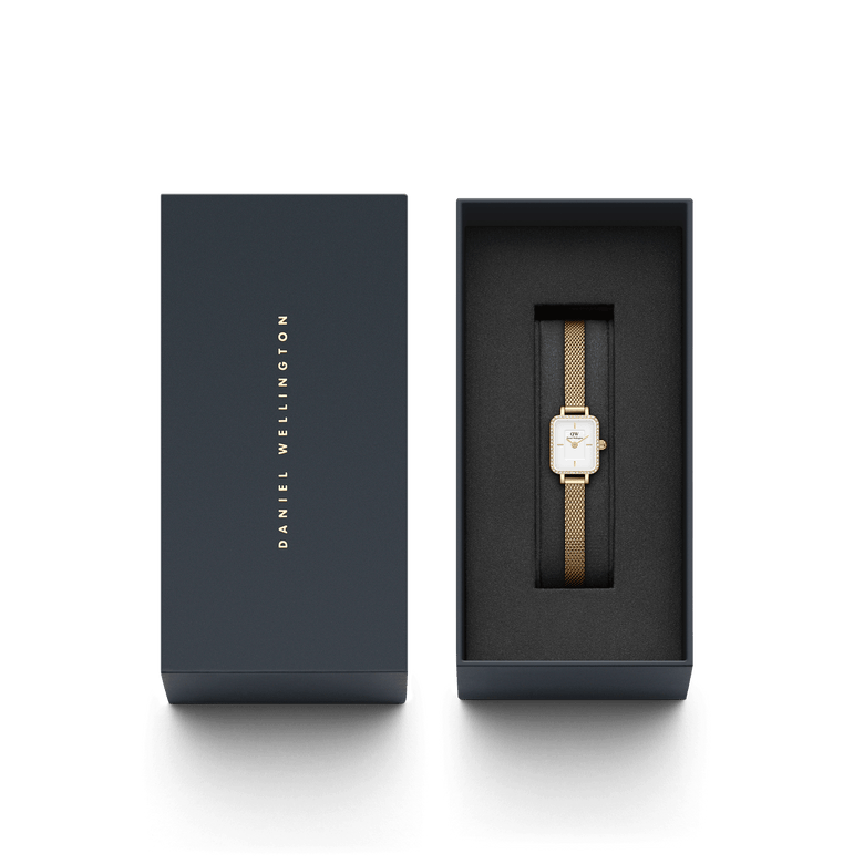Quadro Mini Lumine Bezel Gold ladies watch with a gold mesh strap and crystal bezel, elegantly presented in a branded Daniel Wellington gift box.