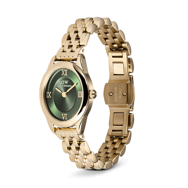 Ophelia Mini Emerald Gold watch with an oval emerald green sunray dial, gold Roman numerals, and a polished gold beans link bracelet featuring a butterfly clasp.