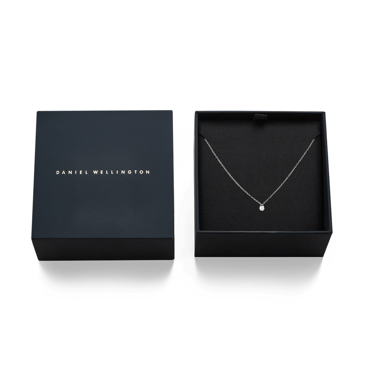 Mirelle Solitaire Necklace Silver presented in a sleek black Daniel Wellington gift box, highlighting the delicate silver chain and cubic zirconia pendant as a stylish gifting option.