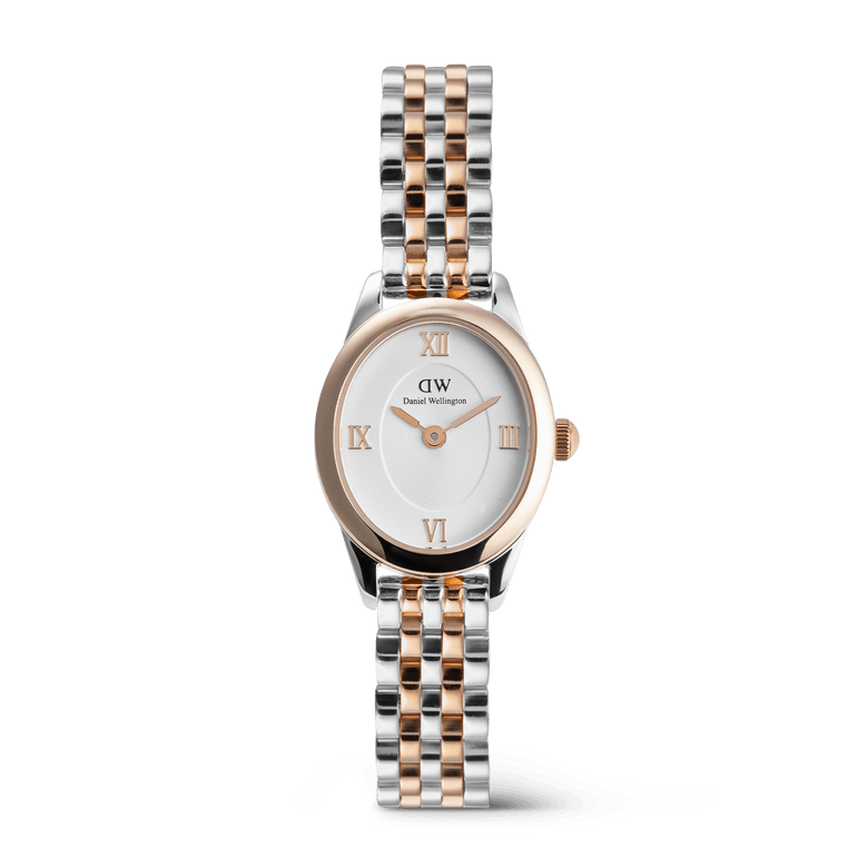 Petite ladies watch with an oval face, featuring a two-tone rose gold and silver five-link bracelet, white dial, and rose gold Roman numerals, designed for a refined and versatile look.