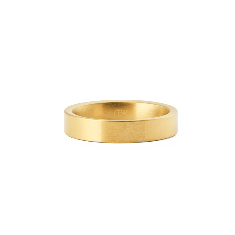 Line Ring Brushed Gold 4.5mm features a classic, minimalist band design with a soft matte gold finish and subtle engraved logo inside, crafted for everyday elegance and comfort.