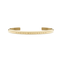 Classic Bracelet Gold by Daniel Wellington shown as a slim, open gold cuff with a subtle engraved logo, featuring a minimalist design and polished finish suitable for both men and women.
