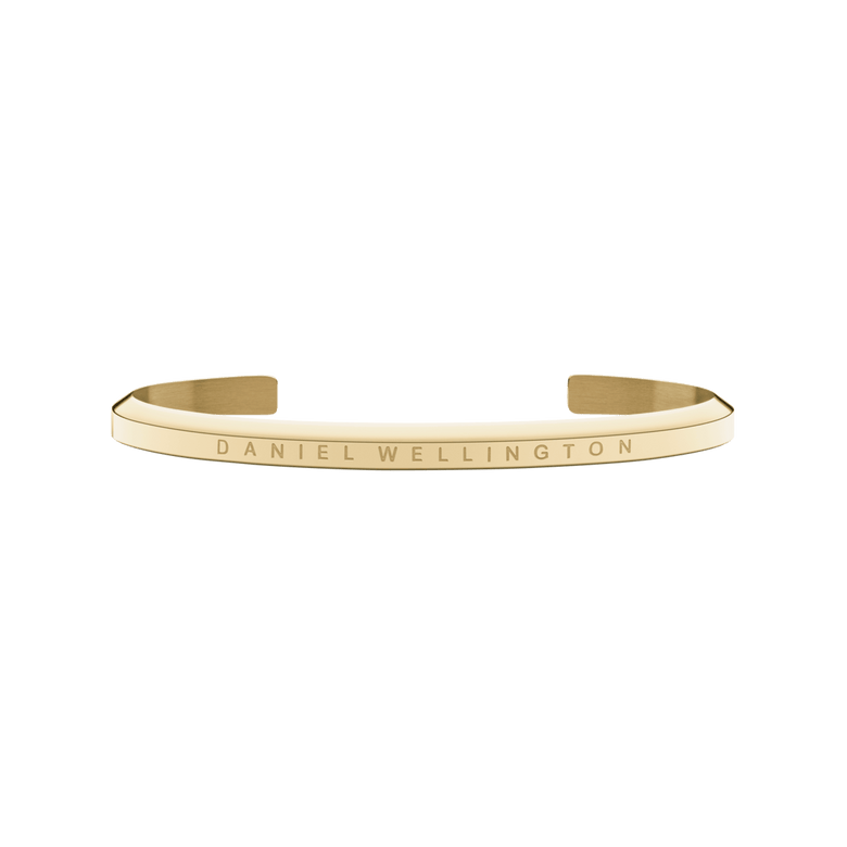 Classic Bracelet Gold by Daniel Wellington shown as a slim, open gold cuff with a subtle engraved logo, featuring a minimalist design and polished finish suitable for both men and women.