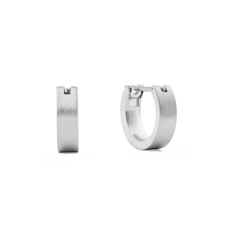 A pair of small brushed silver hoop earrings with a 3.5 mm width, featuring a modern, minimalist design and secure latch-back closure, crafted from stainless steel.