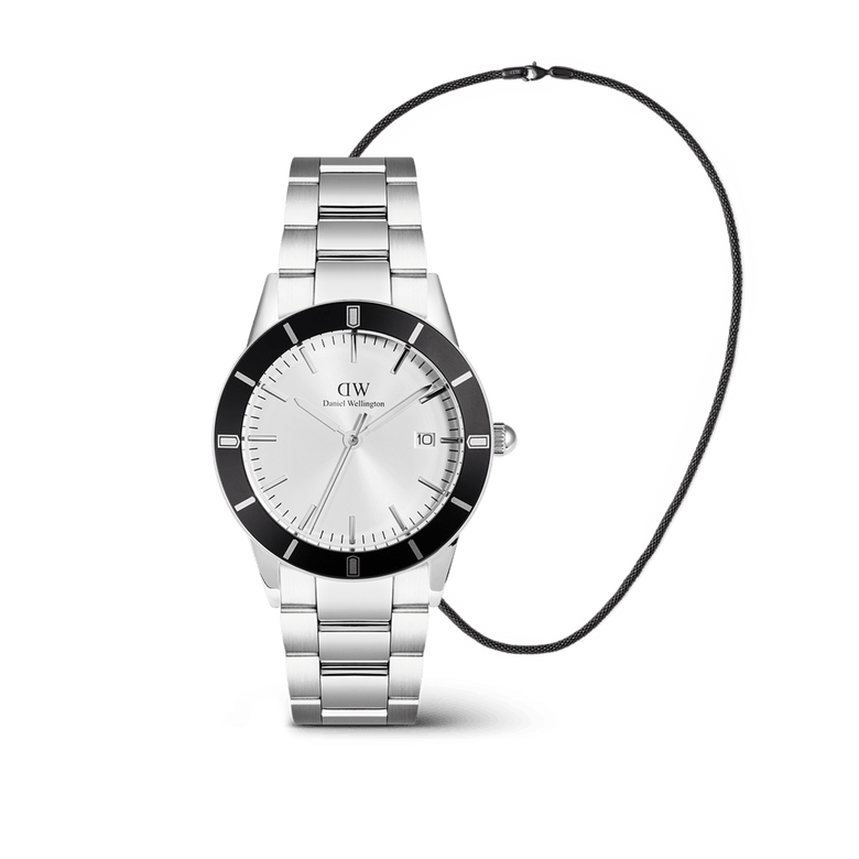 The Iconic Paradigma & Tide Mesh Necklace Black Set features a classic silver Daniel Wellington men’s watch with a bold black bezel and stainless steel strap, paired with a minimalist black mesh chain necklace for a modern, coordinated look.