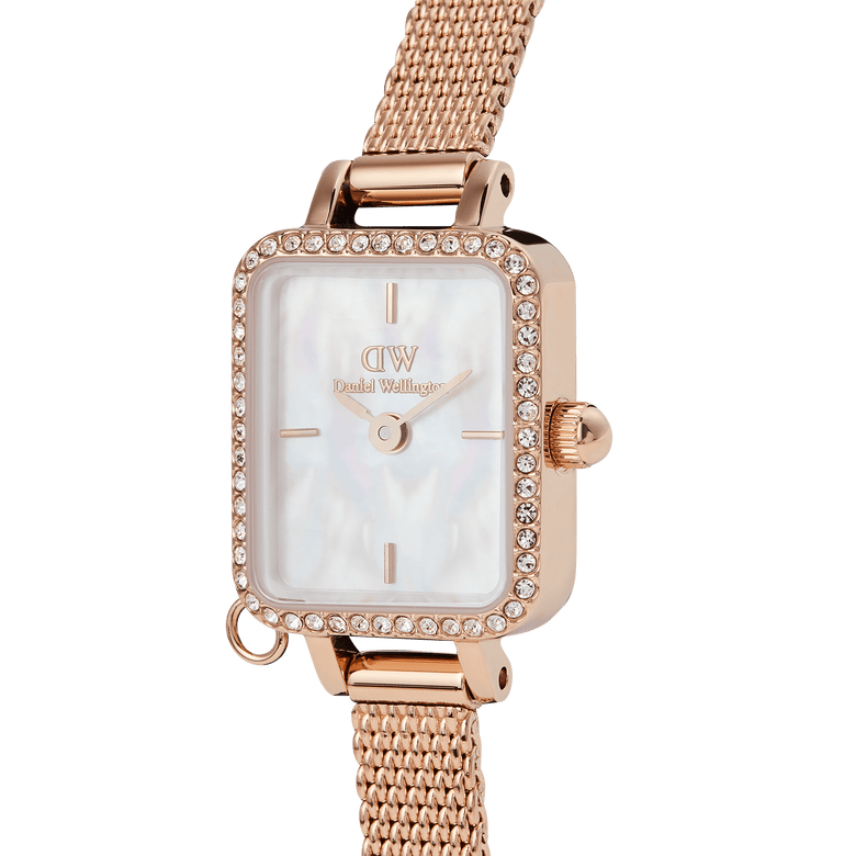 Close-up of the Quadro Mini Crystal Zodiac Melrose featuring a rose gold mesh strap, rectangular case, white mother of pearl dial, and a border of sparkling crystals for a refined, elegant finish.