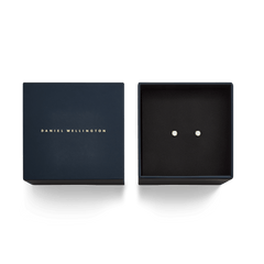 Mirelle Solitaire Stud Earring Gold presented in an elegant black box with gold branding, showcasing the pair of gold stud earrings with sparkling cubic zirconia crystals.