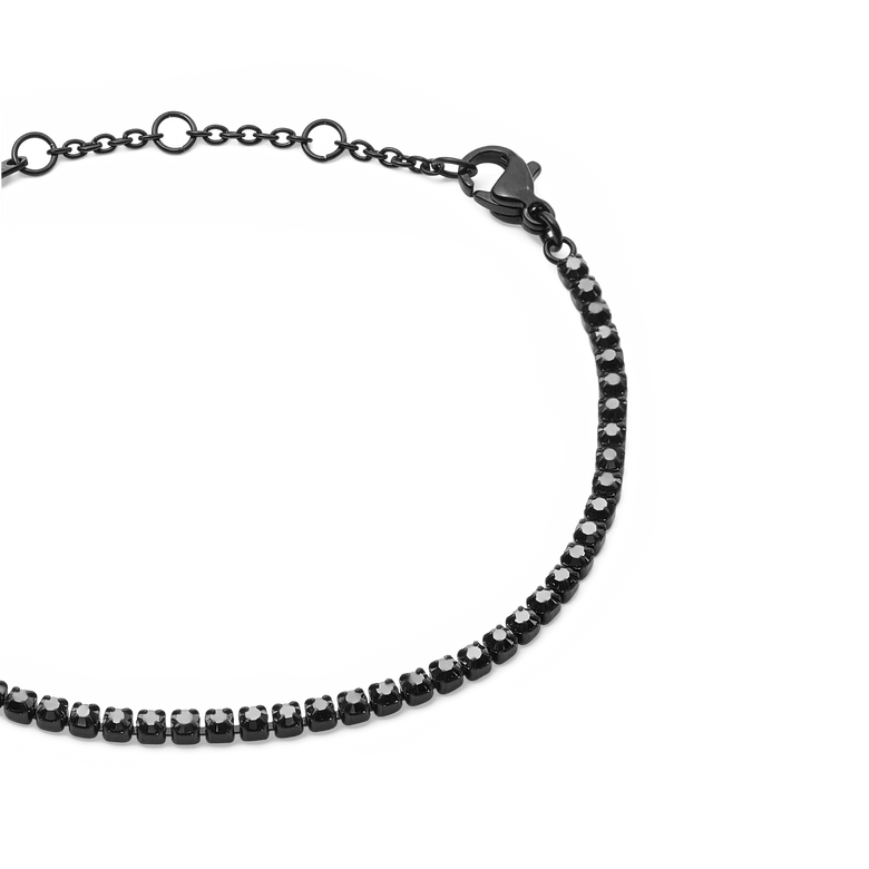 Close-up of the Black Crystal Tennis Bracelet showing the claw-set Preciosa black crystals, adjustable sizing rings, and secure lobster clasp on a sleek black stainless steel chain.