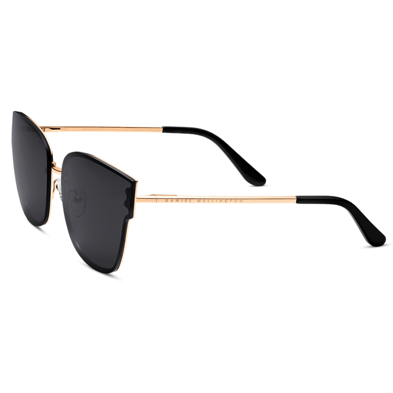 Steel Grande Rose Gold sunglasses featuring oversized square black lenses, slim rose gold plated stainless steel arms, and black acetate temple tips for a comfortable and stylish fit.