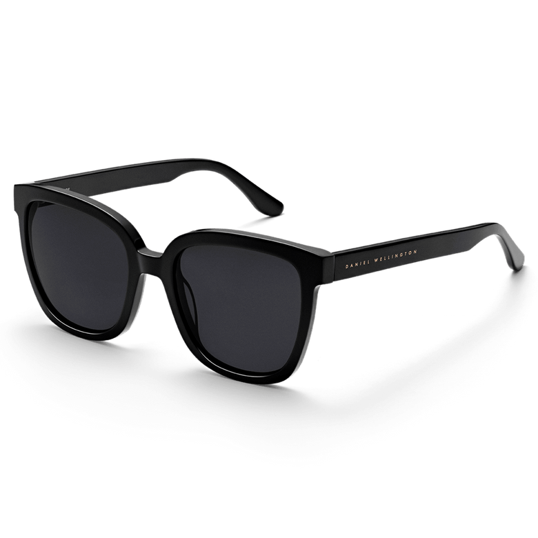 Grande Bio-Acetate Black sunglasses with a bold, oversized square frame in glossy black, featuring dark lenses and subtle Daniel Wellington branding on the temple.