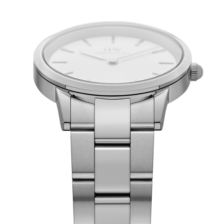 Close-up side view of the Daniel Wellington Iconic Link Silver watch, highlighting the brushed stainless steel three-piece link bracelet and the slim, polished case with minimalist eggshell white dial.