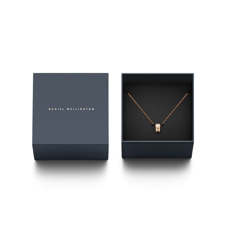 Elan Lumine Necklace Rose Gold displayed in an elegant Daniel Wellington gift box, featuring a rose gold chain with a crystal-embellished round pendant, ideal for gifting on special occasions.