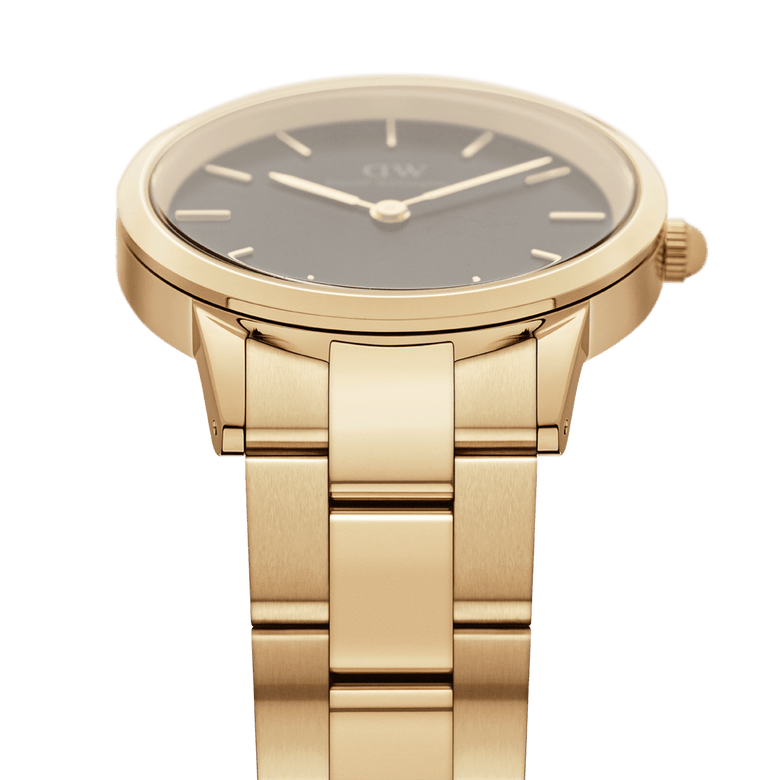 Daniel Wellington Iconic Link Black Gold watch featuring a brushed gold stainless steel bracelet, slim gold links, and a minimalist black dial with gold hour markers.