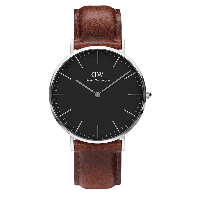 Classic St Mawes Black Silver watch with a black minimalist dial, slim silver case, and a smooth brown leather strap, showcasing a timeless and versatile design.