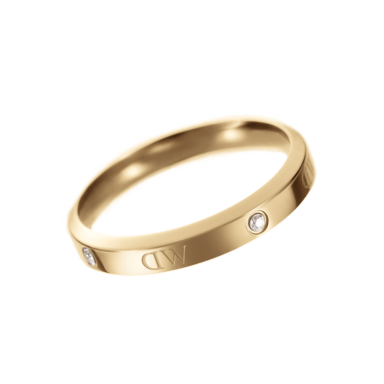 Classic Lumine Ring Gold with a curved polished gold band, featuring sparkling crystal accents and engraved logo detail, designed for a modern and elegant look.