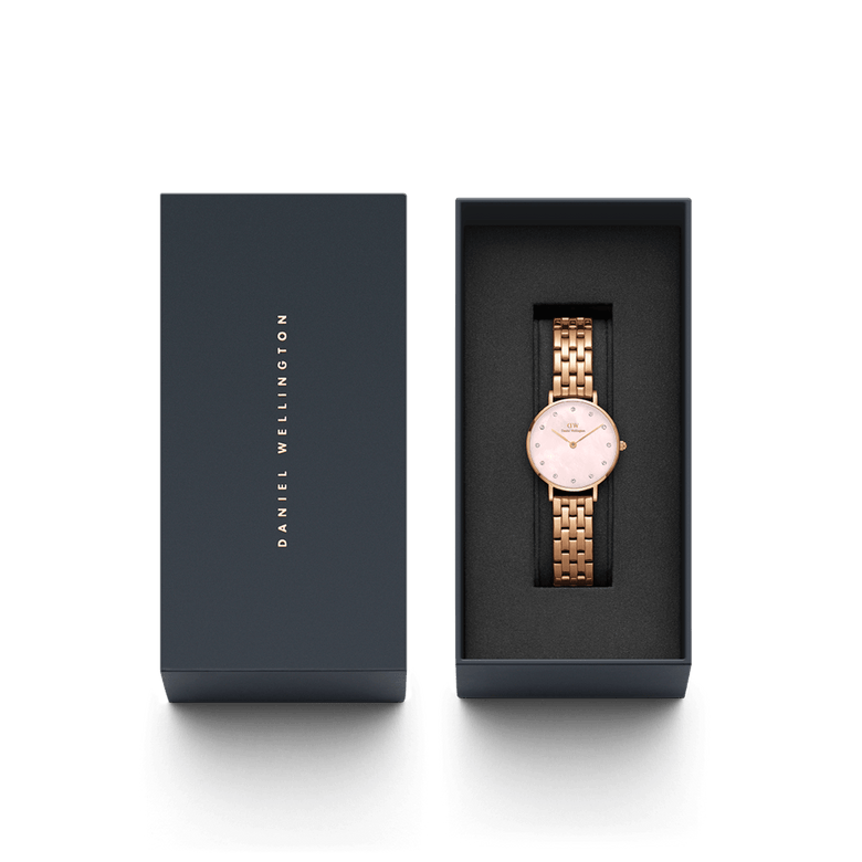 Petite Lumine 5 Link Melrose Pink MoP Rose Gold ladies watch with a rose gold bracelet and pink mother of pearl dial, elegantly presented in a branded Daniel Wellington gift box.