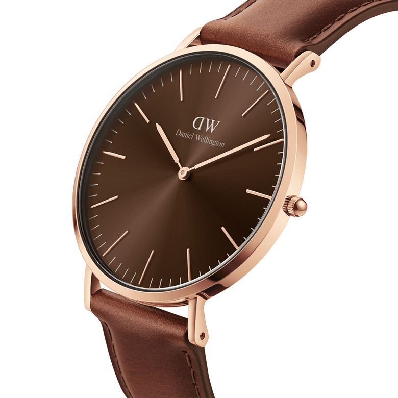 Classic St Mawes Amber Rose Gold watch featuring a sunray brown dial, slim rose gold case, minimalist markers, and a brown Italian Nappa leather strap, shown in a close-up angled view.