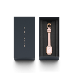 Quadro Pressed Rouge ladies watch with a pink croc-pattern leather strap and rose gold rectangular case, elegantly presented in a branded Daniel Wellington gift box.